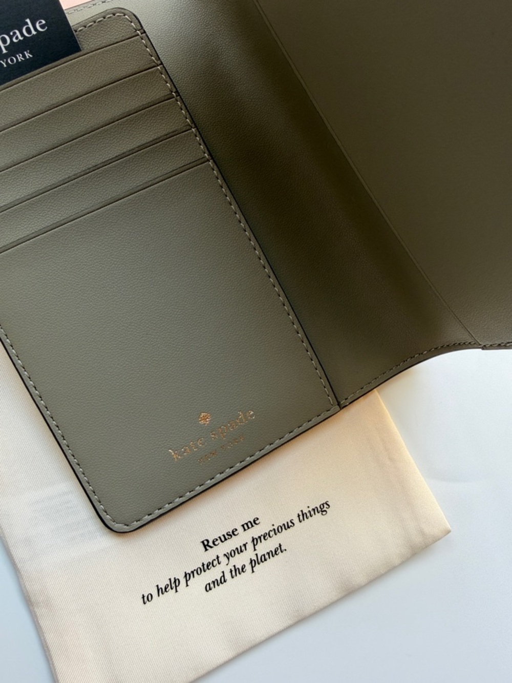 kate spade card holder & passport wallet with gold logo in oyster shell color - Picture 12 of 14